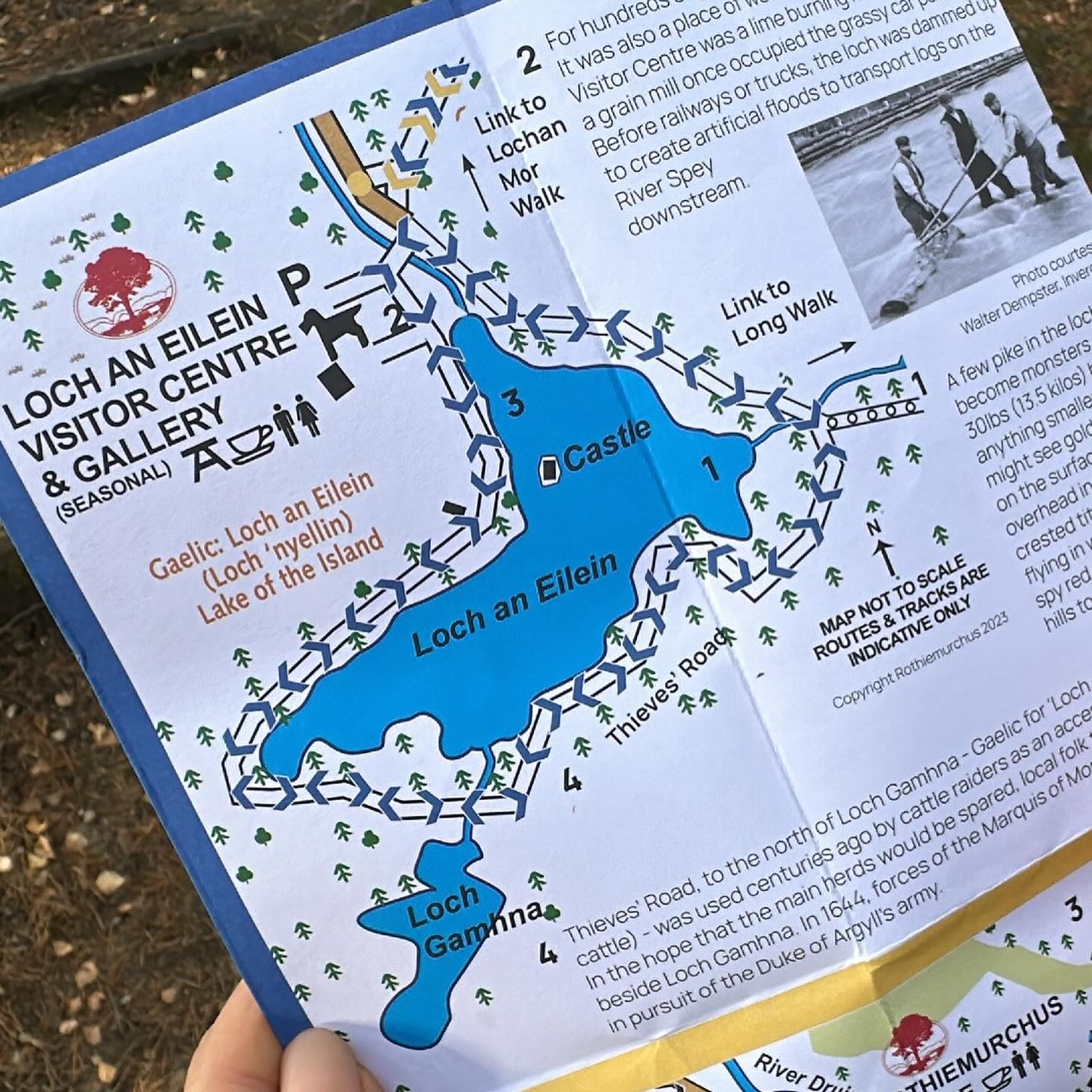 A printed Loch an Eilein visitor leaflet showing the loch and walking paths.